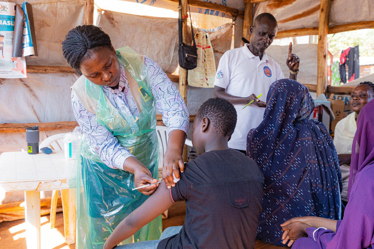 Refugees from Sudan are registered at the Kyriandongo reception center in Uganda. UNHCR and partners conduct health assessments, vaccinations, data collection and registration for newly arrived refugees from Sudan. Once this registration is complete, refugees are able to access additional services, including healthcare, education and the right to work. Uganda currently hosts the largest number of refugees in Africa – around 1.7 million people and welcomes more every day. As of July 2024, there were around 250 new arrivals from Sudan every day, and more than 30,000 people had come since the start of the year. Most having crossed multiple borders and traveled hundreds of miles on foot to find safety after fleeing war in Sudan. Refugees from Sudan are registered at Kyriandongo reception center in Uganda